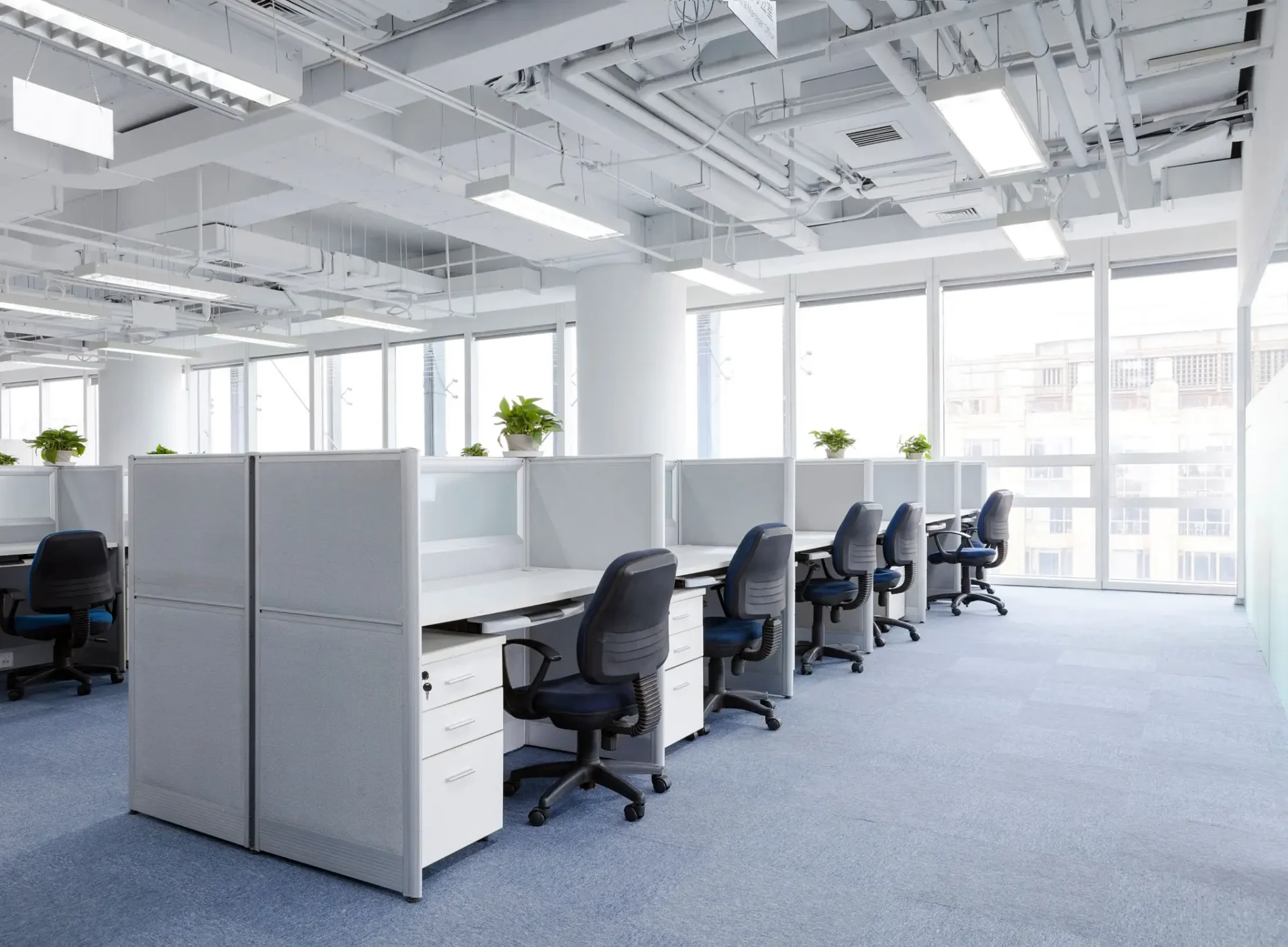 Bright empty open-plan office with desks